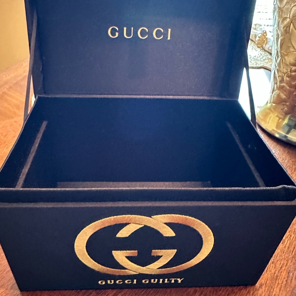 Gucci guilty black Jewelry box. Can hold anything from perfume to trinkets.